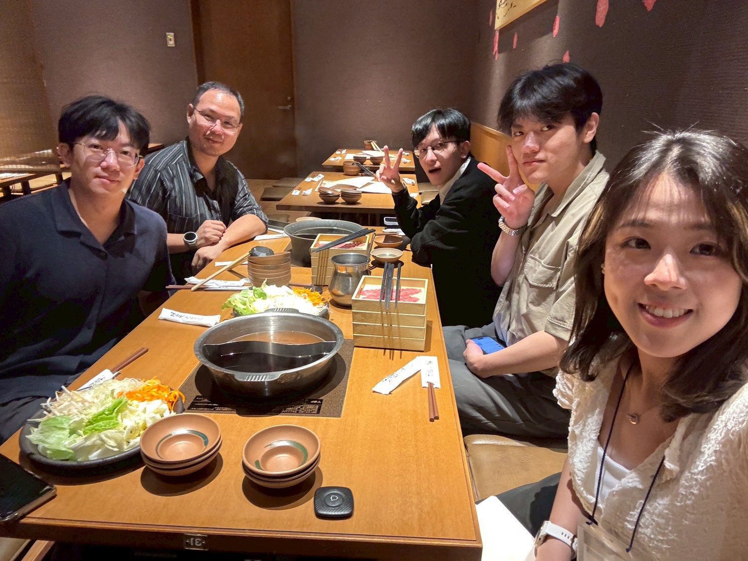 Research team dinner during the JpGU 2026 conference trip.
