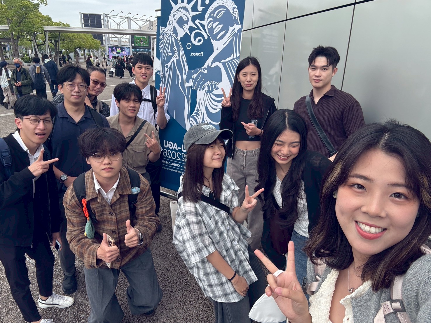 Research group selfie outside the JpGU 2026 venue.